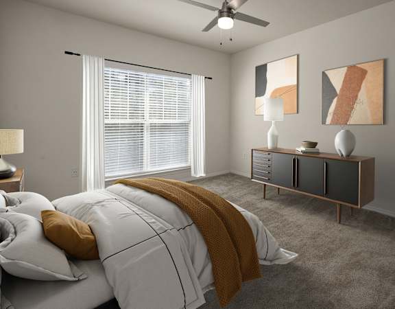 a bedroom with a bed and a ceiling fan