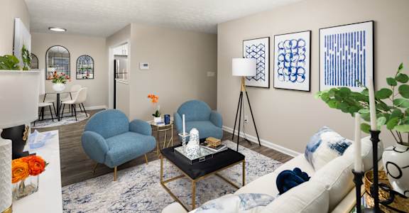 a living room with couches and chairs and a table