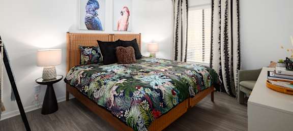 a bedroom with a bed and a ceiling fan