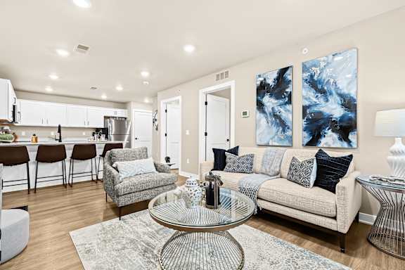 a living room with couches and a coffee table