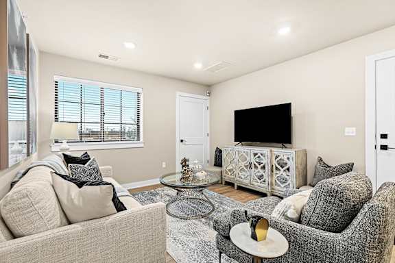 a living room with a couch and a tv