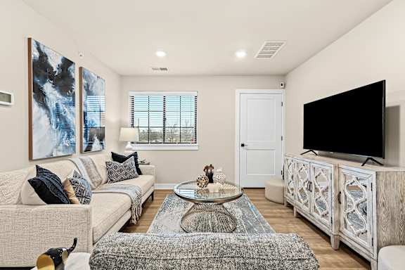a living room with a couch and a tv