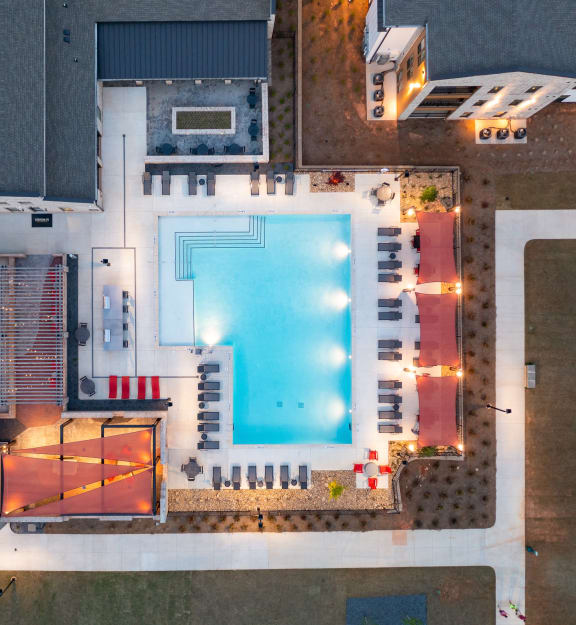 arial view of a swimming pool on a roof of a building