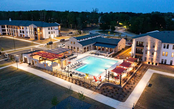 a night view of a pool at night at the resort at night