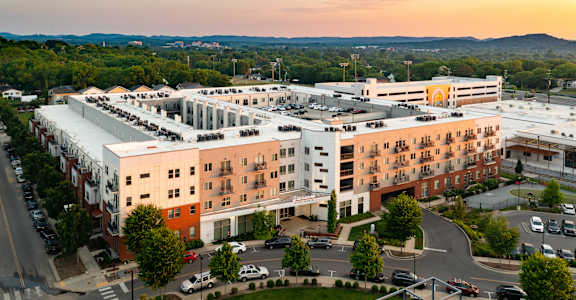 an aerial view of a building in the city