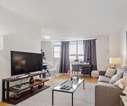 a living room with a couch and a coffee table and a television