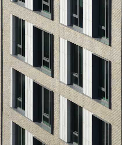 A building with many windows and no one in them.