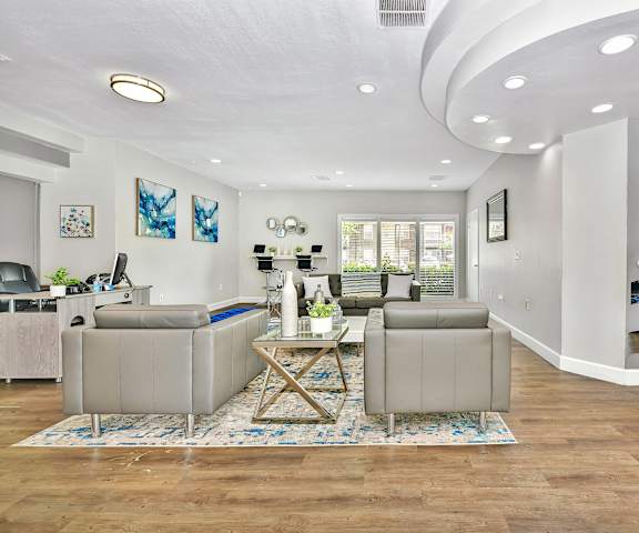 A living room with a pool table and a dining table.