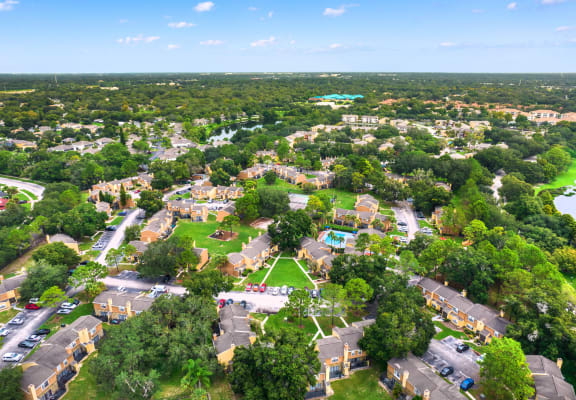an aerial view of a neighborhood with houses and trees at Village Park, Orlando, 32808