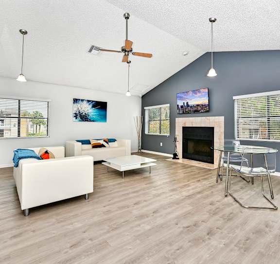 a living room with couches and a coffee table