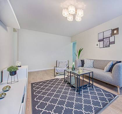 a living room with a couch and a table