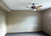 Thumbnail 2 of 5 - an empty room with a ceiling fan