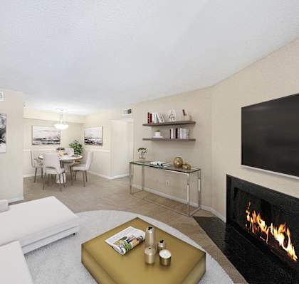 a living room with a fireplace and a couch