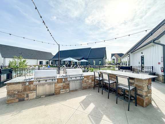 spacious outdoor patio with grill and bar and seating  at The BLVD at Wilson Crossings, Wyoming