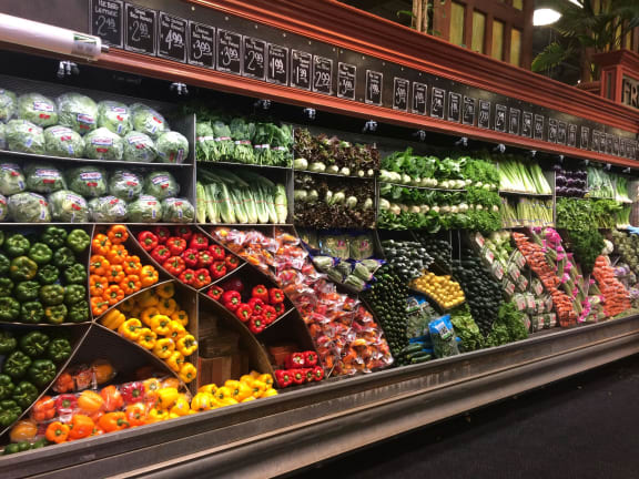 a display of fruits and vegetables in a grocery store