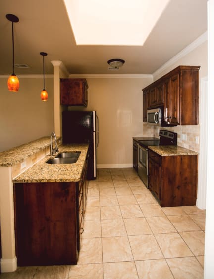 a kitchen with a sink and a counter top