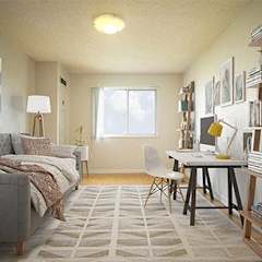 a living room with a couch and a desk