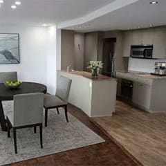a kitchen and dining room with a table and chairs
