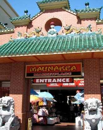 a building with a sign for the entrance to a market