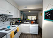 Thumbnail 6 of 24 - Spacious kitchens include plenty of above and below cabinet storage and meal prep space.