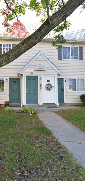 an empty kitchen with a door leading into a yard