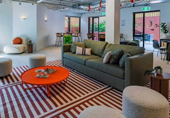 a living room filled with furniture and a rug