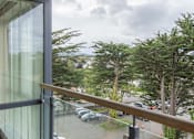 Thumbnail 4 of 5 - the view of the parking lot from the balcony