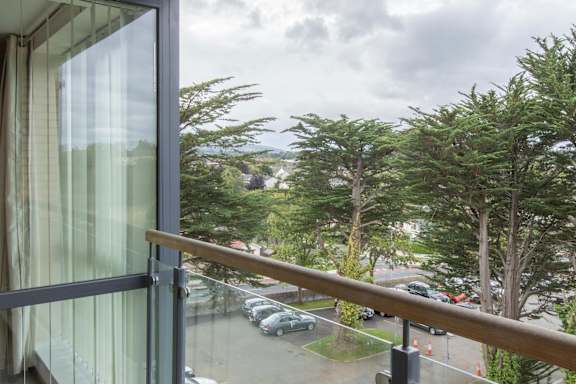 the view of the parking lot from the balcony
