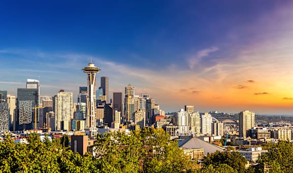 a view of the seattle skyline at sunset