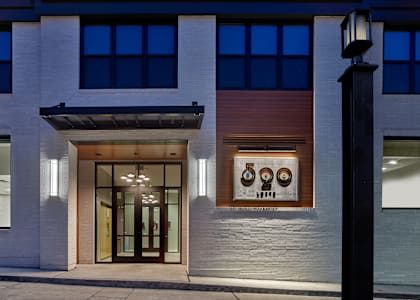 the front of a building at night with a glass door at 520 Lofts, Pennsylvania 18101
