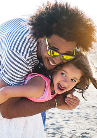 Child and parent at the beach  Aqua 2800 Apartments in Oakland Park Florida