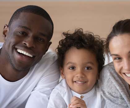 a family sitting on a couch