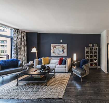 A modern living room with a black and white color scheme.