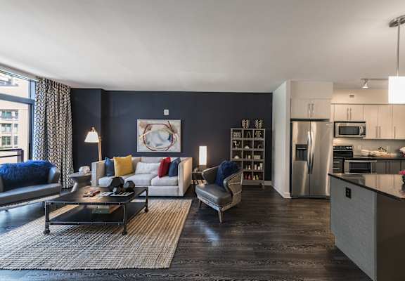 A modern living room with a black and white color scheme.