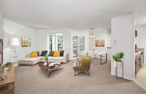 A living room with a white couch and a yellow pillow.
