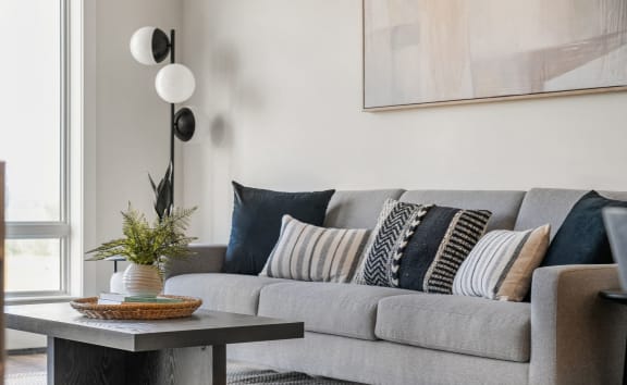 a living room with a couch and a table