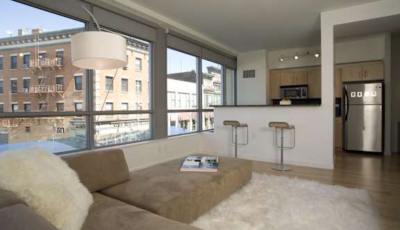 A living room with a couch and a table.