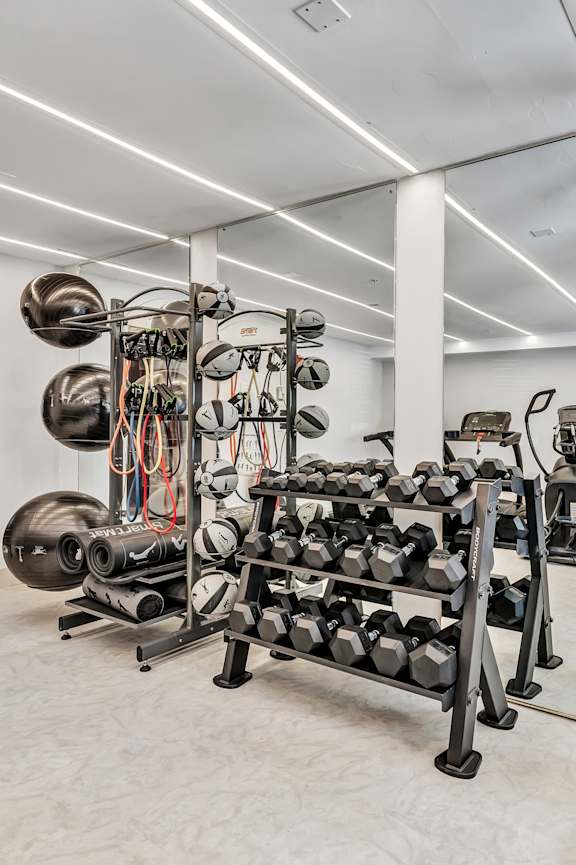 a rendering of a gym with treadmills and weights at The Meriden, Meriden Connecticut
