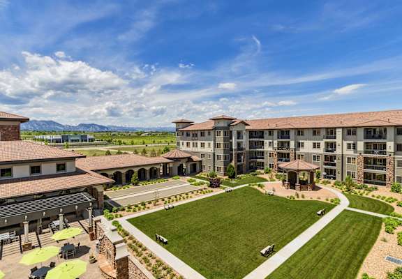 an aerial view of an apartment complex with a lawn and a courtyard at Terracina, Broomfield, CO