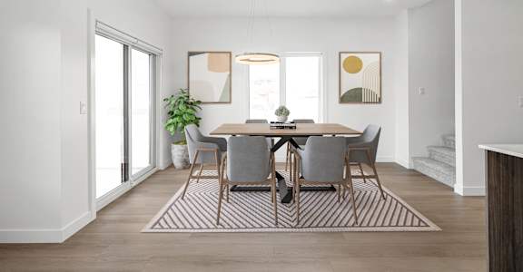 A dining room with a table set for four.