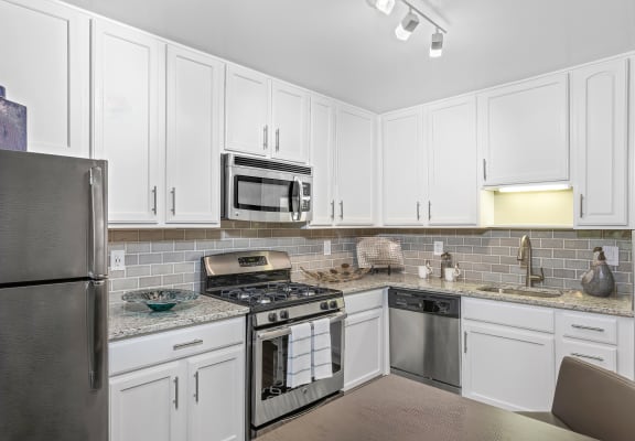 Modern Kitchen With Stainless Steel Appliances And Double Door Refrigerators at Versailles Apartments, Towson, 21204