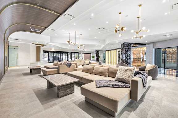 a lobby of a building with couches and tables at Up House, Farmington, 06032