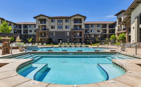 A large swimming pool in front of apartment buildings at Terracina, Broomfield, CO 80020