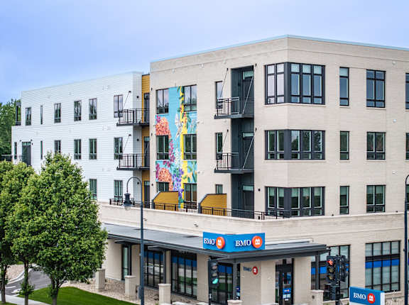A modern building with a BMO bank branch in front.