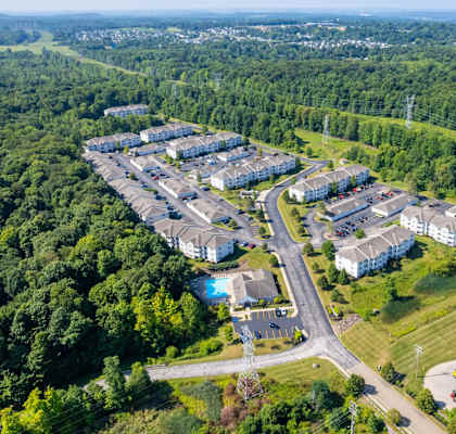 a aerial view of a group of buildings and a road