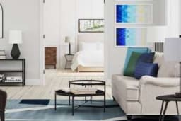 a living room with a couch and a table