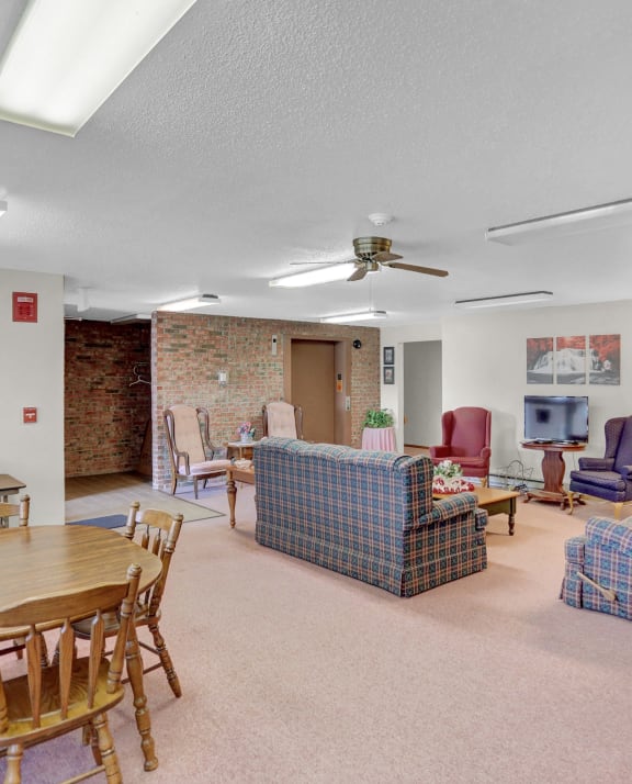 a living room with couches chairs and a table