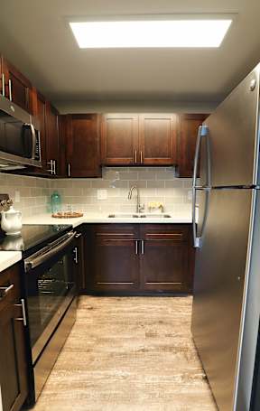 Spacious kitchen floorplan with stainless steel appliances