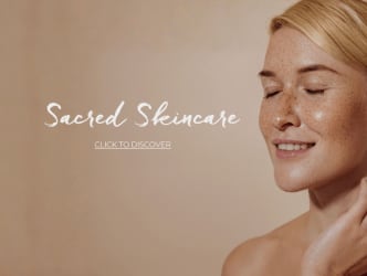 A woman with blonde hair and freckles is featured in a skincare advertisement.