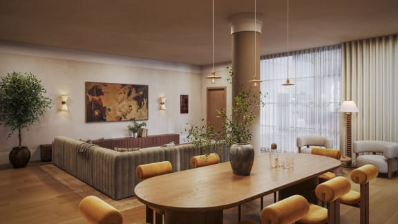 a living room with a couch and a table and chairs